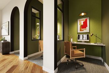 A room with a green wall and a wooden floor.